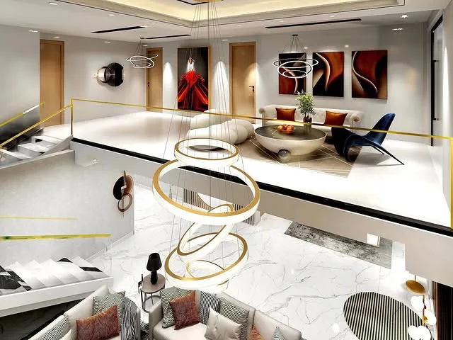 A stylish modern living room featuring a staircase and an elegant large chandelier, creating a warm and inviting atmosphere.